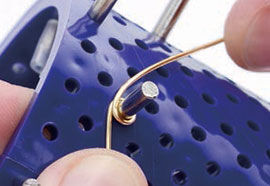 Wire being wrapped around jig peg